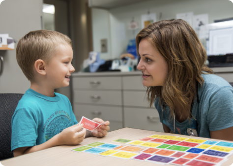 Behavioral health specialist working with a child using colorful cards