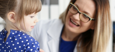 Doctor reviewing care with a young patient