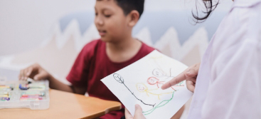 Child drawing during a behavioral health session