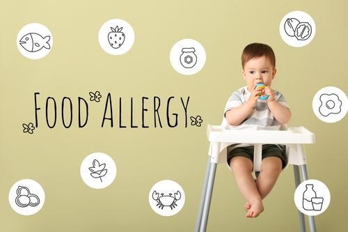 Food allergy concept showing child and allergenic foods